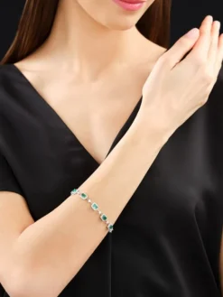 Bransoletka z białego złota z brylantami i szmaragdami - 19 cm - próba 750