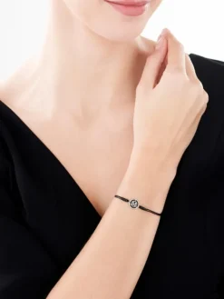 Bransoletka z elementami żółtego złota, diamentem i onyksem  - litera M - próba 375