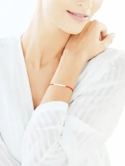 Bransoletka z elementami z żółtego złota - love