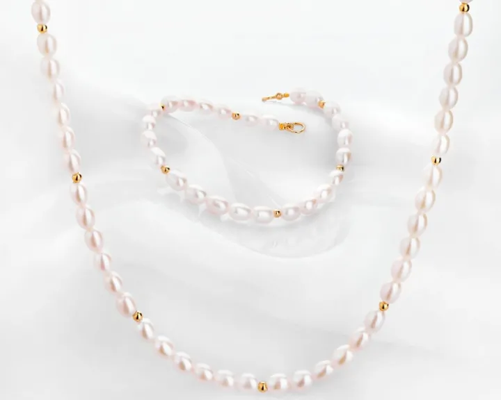 Bransoletka z elementami z żółtego złota - perły