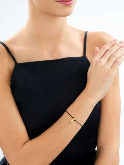 Bransoletka z elementami srebra - litera K, motyl