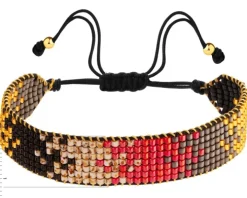 Bransoletka z elementami z żółtego złota i koralikami