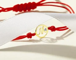 Bransoletka z elementami żółtego złota i diamentem - litera M - 0,003 ct - próba 375