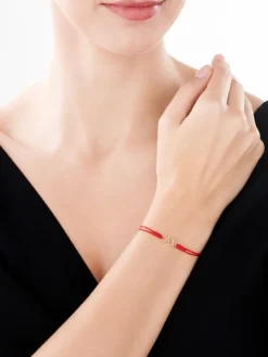 Bransoletka z elementami żółtego złota i diamentami - rower - 0,006 ct - próba 375