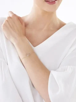 Bransoletka z żółtego i białego złota z brylantem - koła - 0,01 ct - próba 375