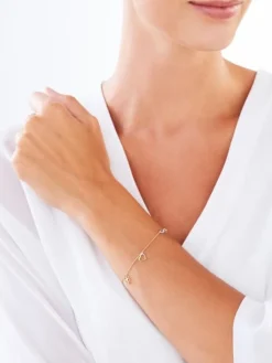 Bransoletka z żółtego złota z diamentami - serce, nieskończoność, koniczyna - 0,01 ct - próba 375