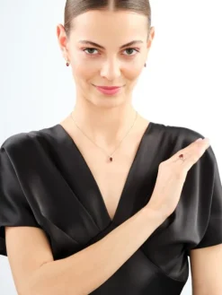 Pierścionek z żółtego złota z diamentami i granatem - próba 585