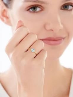 Pierścionek z żółtego złota z diamentami i topazem - próba 375