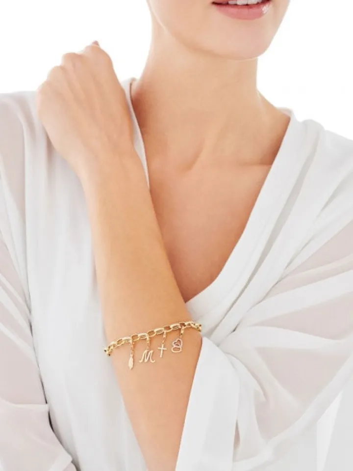 Zawieszka charms z żółtego złota z diamentem - serca - 0,003 ct - próba 375