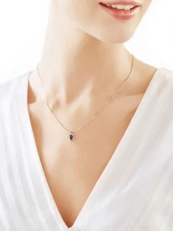 Zawieszka z białego złota z diamentem i topazem London Blue - próba 375