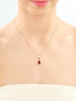 Zawieszka z żółtego złota z brylantami i granatami - próba 585