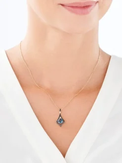 Zawieszka z żółtego złota z brylantami i topazem London Blue - próba 585