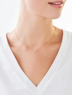 Zawieszka z żółtego złota z diamentem - litera L, serce - 0,005 ct - próba 375
