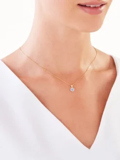 Zawieszka z żółtego złota z diamentami i tanzanitem - próba 585