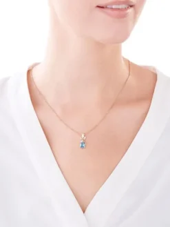 Zawieszka z żółtego złota z diamentami i topazem - róża, liście - próba 375