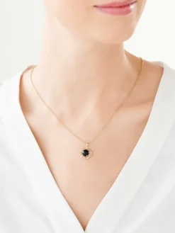 Zawieszka z żółtego złota z diamentami i onyksem - próba 585