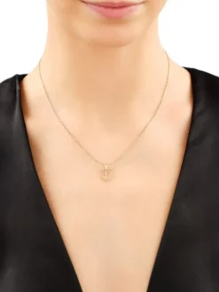 Zawieszka z żółtego złota z diamentem - serce, krzyż - 0,002 ct - próba 585