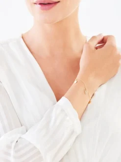 Złota bransoletka - rozety, koła