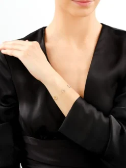 Złota bransoletka z cyrkoniami - rozety