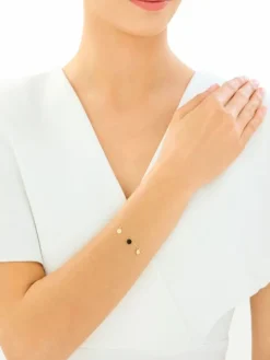 Złota bransoletka z onyksem syntetycznym - koła