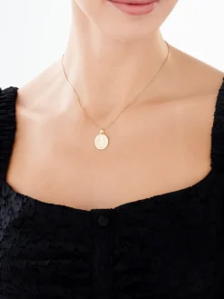 Złota zawieszka - medalik z wizerunkiem Chrystusa