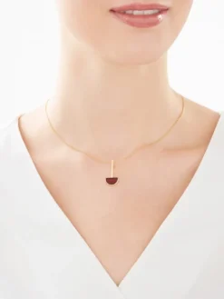 Złota zawieszka z bursztynem