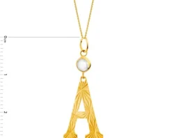 Złota zawieszka z cyrkonią - litera A