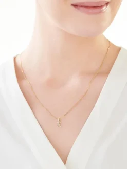 Złota zawieszka z cyrkonią - litera K