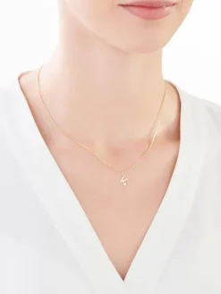 Złota zawieszka z cyrkonią - litera K