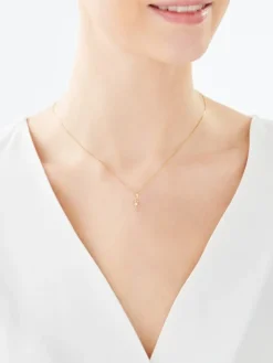 Złota zawieszka z cyrkonią - krzyż