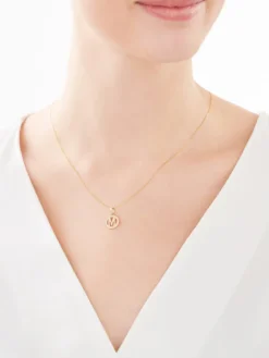 Złota zawieszka z cyrkoniami - litera M