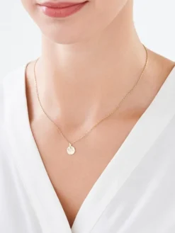 Złota zawieszka z emalią - stópki, "my baby"