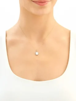 Złota zawieszka z opalitem i cyrkoniami