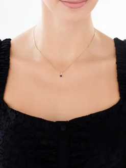 Złota zawieszka z szafirem syntetycznym