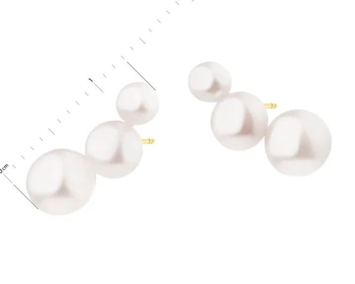 Złote kolczyki z perłami