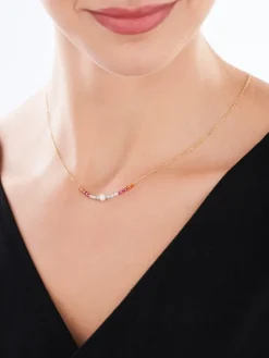 Złoty naszyjnik z perłą i korundami